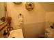 Stylish half-bathroom with gold fixtures and a modern design at 13538 Pine Harbor Rd, Charlotte, NC 28278