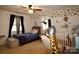 bedroom with fun decor, unique wall art, and a comfortable layout ideal for play and rest at 13538 Pine Harbor Rd, Charlotte, NC 28278