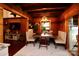 Cozy dining room featuring wood accents, a stylish chandelier, and views into the living room at 13538 Pine Harbor Rd, Charlotte, NC 28278