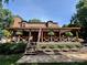Inviting two-story home with a cozy covered porch and manicured landscaping at 13538 Pine Harbor Rd, Charlotte, NC 28278