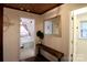 Hallway view featuring hardwood floors, stylish decor, and seamless transition to the bedroom and bathroom at 13538 Pine Harbor Rd, Charlotte, NC 28278