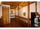 Hallway featuring wood accents, modern lighting, and access to various rooms, blending style and functionality at 13538 Pine Harbor Rd, Charlotte, NC 28278