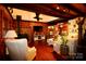 Comfortable living room features a stone fireplace and rustic wood finishes at 13538 Pine Harbor Rd, Charlotte, NC 28278