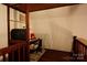 Functional loft space with desk, chair, and shelving, offering versatility and a cozy atmosphere at 13538 Pine Harbor Rd, Charlotte, NC 28278