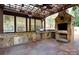 Outdoor kitchen featuring granite countertops, a built-in grill, and stone accents at 13538 Pine Harbor Rd, Charlotte, NC 28278