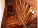 View of a wooden staircase featuring wood banisters and treads, adding warmth and character to the home at 13538 Pine Harbor Rd, Charlotte, NC 28278