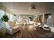 Relaxing sunroom with hammocks, comfortable seating, and lots of natural light at 13538 Pine Harbor Rd, Charlotte, NC 28278