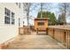 Wooden deck leads to a custom wooden shed in the backyard, enhancing the outdoor experience at 141 Byers Rd, Troutman, NC 28166