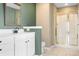 Bathroom with a vanity, shower with gold trim and a toilet; offers functionality and style at 141 Byers Rd, Troutman, NC 28166