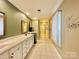 Double vanity bathroom with walk-in shower and tile floors at 141 Byers Rd, Troutman, NC 28166