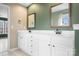 Spacious bathroom features double sinks, ample counter space, mirrors, and natural light at 141 Byers Rd, Troutman, NC 28166