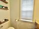 Toilet and decorative shelving in an updated bathroom at 141 Byers Rd, Troutman, NC 28166