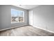 Bedroom featuring wood-look floors and natural light from the large window at 141 Byers Rd, Troutman, NC 28166