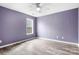 Bedroom featuring wood-look floors, a ceiling fan, and natural light from the window at 141 Byers Rd, Troutman, NC 28166