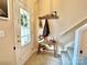 Bright entryway with a bench, coat rack, and stairs at 141 Byers Rd, Troutman, NC 28166