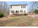 Rear exterior view of home and backyard with deck at 141 Byers Rd, Troutman, NC 28166