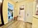 Hallway view of bedroom and bathroom with hardwood floors at 141 Byers Rd, Troutman, NC 28166