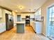 Modern kitchen with white cabinets, a teal island, and stainless steel appliances at 141 Byers Rd, Troutman, NC 28166