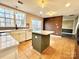 Modern kitchen features island, white cabinets, and stainless steel appliances at 141 Byers Rd, Troutman, NC 28166