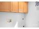 Clean laundry room with overhead cabinets and hookups, providing a functional space at 141 Byers Rd, Troutman, NC 28166