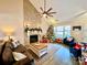 Spacious living room features a stone fireplace, hardwood floors, and a Christmas tree at 141 Byers Rd, Troutman, NC 28166