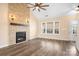 Bright living room featuring a stone fireplace, hardwood floors, and neutral paint at 141 Byers Rd, Troutman, NC 28166