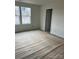 Unfinished bedroom with new flooring and large windows at 164 Wildwood Loop, Statesville, NC 28677