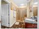 A well-appointed bathroom shows granite countertop vanity and glass-enclosed tiled shower with floral wall art at 210 N Church St # 2702, Charlotte, NC 28202