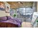 Bright bedroom with panoramic skyline views through floor to ceiling windows at 210 N Church St # 2702, Charlotte, NC 28202