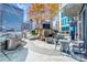 Inviting rooftop deck with BBQ, outdoor fireplace, and comfortable seating areas at 210 N Church St # 2702, Charlotte, NC 28202