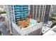 Breathtaking rooftop pool with lounge chairs and trees, providing an urban escape at 210 N Church St # 2702, Charlotte, NC 28202