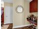 Wet bar showcasing granite countertop, dark wood cabinetry, wine rack, and a round mirror on the wall at 210 N Church St # 2702, Charlotte, NC 28202