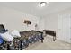 Well-lit bedroom with carpet, a single bed, and a small desk by the closet at 2117 Talbert Ct, Charlotte, NC 28214