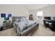 A rustic bedroom features a reclaimed wood bed frame, matching nightstand and desk with natural light at 2117 Talbert Ct, Charlotte, NC 28214