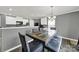 A charming dining area featuring a stylish wood table and chairs with seating, perfect for Gathering meals at 2117 Talbert Ct, Charlotte, NC 28214