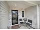 Inviting front porch with seating area, creating a cozy and welcoming entrance to the home at 2117 Talbert Ct, Charlotte, NC 28214