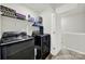 Well-organized laundry room with modern washer and dryer, plus shelving for storage at 2117 Talbert Ct, Charlotte, NC 28214