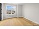 Bedroom with hardwood floors and a window with a view of the neighborhood at 2205 Catalina Ave, Charlotte, NC 28206