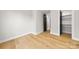 Light filled bedroom with hardwood floors and spacious closet at 2205 Catalina Ave, Charlotte, NC 28206