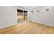 Light-filled bedroom with hardwood floors and sliding glass doors to backyard at 2205 Catalina Ave, Charlotte, NC 28206