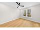 Bright, airy bedroom featuring hardwood floors, neutral walls, and a contemporary ceiling fan at 2205 Catalina Ave, Charlotte, NC 28206