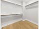 Walk-in closet with ample shelving providing efficient storage solutions at 2205 Catalina Ave, Charlotte, NC 28206