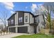 Modern three-unit building with stone and dark accents at 2205 Catalina Ave, Charlotte, NC 28206