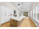 Modern kitchen with white cabinets, quartz countertops, and hardwood floors at 2205 Catalina Ave, Charlotte, NC 28206