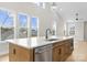 Modern kitchen island with white quartz countertop and stainless steel appliances at 2205 Catalina Ave, Charlotte, NC 28206