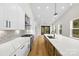 Modern kitchen with white cabinets, quartz countertops and herringbone backsplash at 2205 Catalina Ave, Charlotte, NC 28206