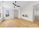 Light-filled living room featuring hardwood floors and a modern fireplace at 2205 Catalina Ave, Charlotte, NC 28206