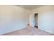 A bedroom with an open closet, neutral walls, and soft carpeting at 251 Winford Rd, Troutman, NC 28116