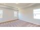 Carpeted bedroom with natural light and a modern tray ceiling with recessed lighting at 251 Winford Rd, Troutman, NC 28116