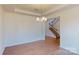 Bright dining room with modern chandelier, hardwood floors, and staircase view at 251 Winford Rd, Troutman, NC 28116